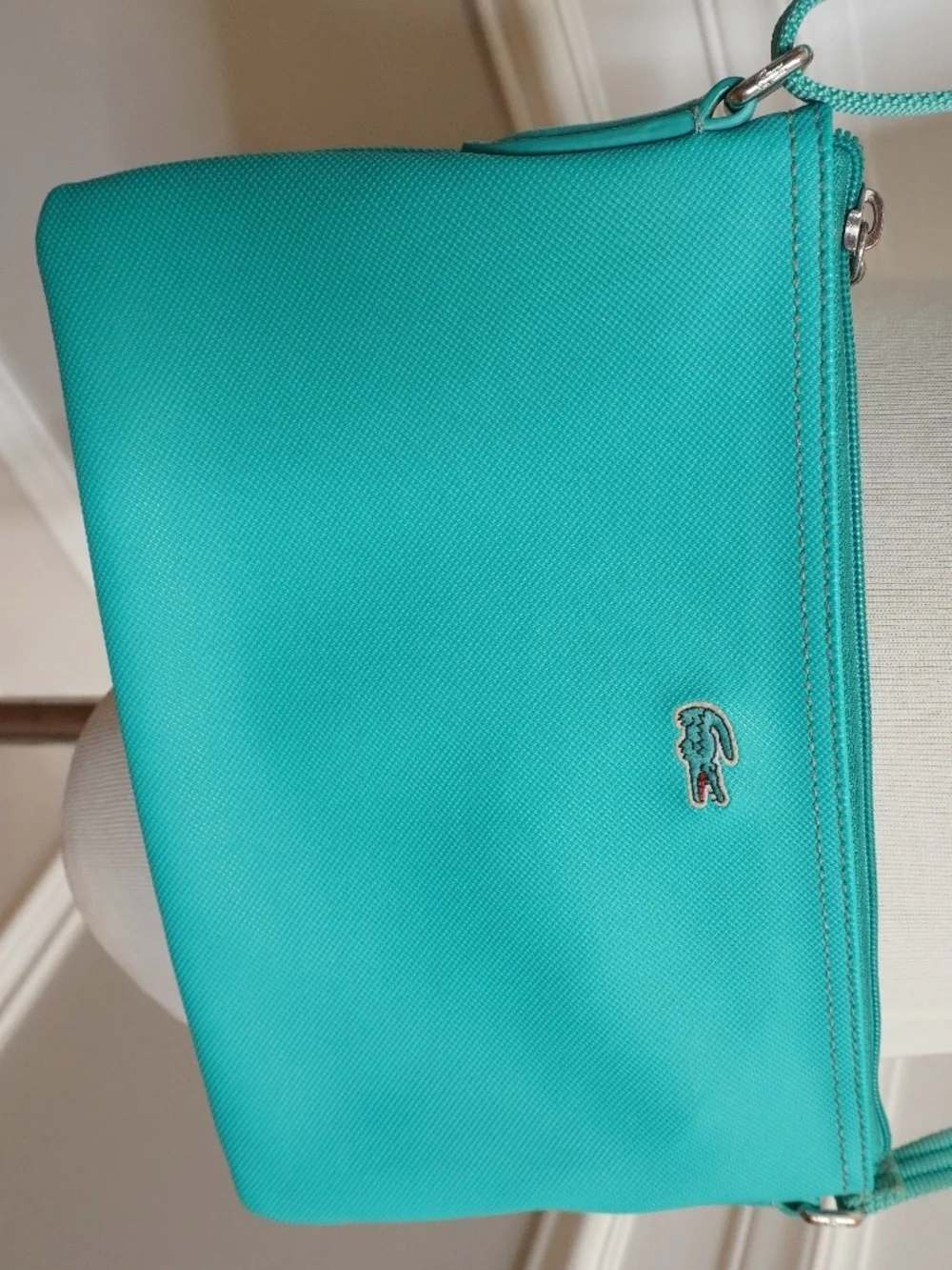 Lacoste Teal crossover bag PVC w/leather trimming